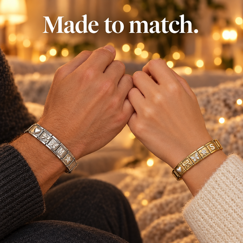 Couple wearing matching charm bracelets
